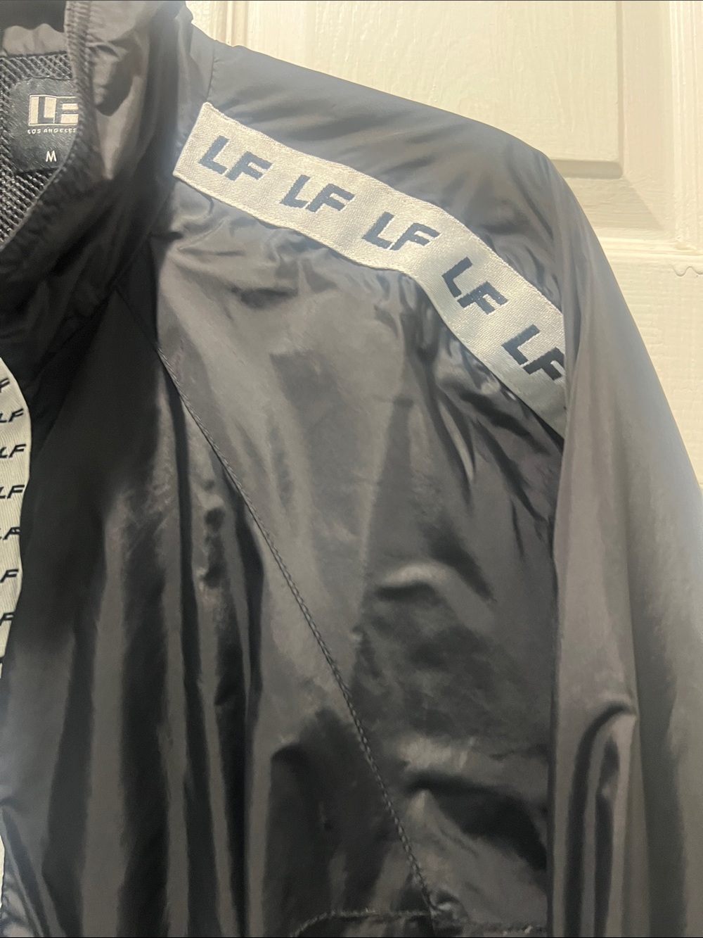 LF Black Cropped Bomber Jacket with White Logo Trim - Picture 5 of 10